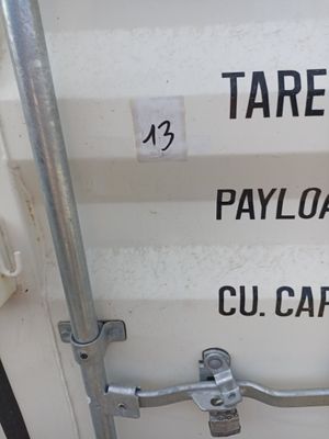 a close up of a white container with black writing on it