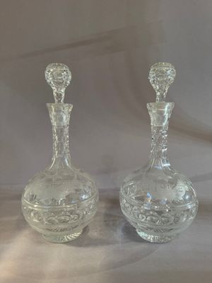 pair of clear glass decanters on a white background
