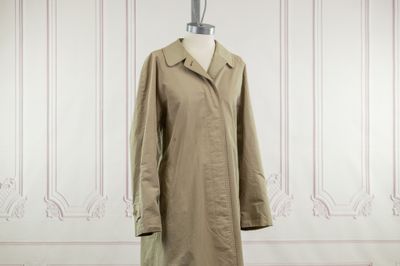an image of a woman ' s coat on a mannequin