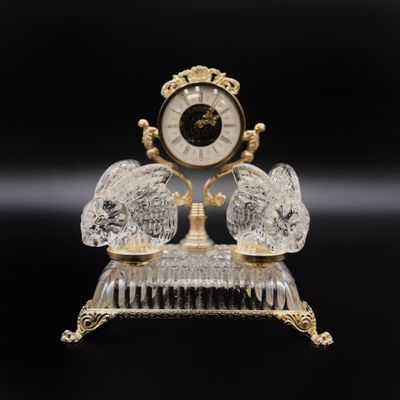 a crystal clock on a stand on a black background