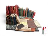 a pile of old books sitting on a table
