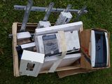 a box full of electronic equipment on the grass