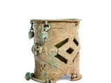 an image of a small metal candle holder with a lion on it