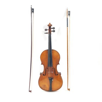 a violin that is sitting next to a bow