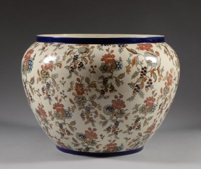a vase with a floral design on it on a table