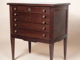 an antique chest of drawers with a marble top and wooden legs
