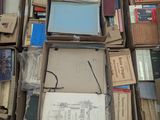 many boxes of books stacked on top of each other