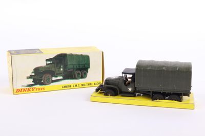 an image of a toy truck and a box on a white surface