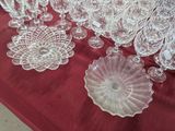 a red table with a lot of glassware on it