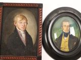 three framed portraits of men in suits and ties sit on a wall