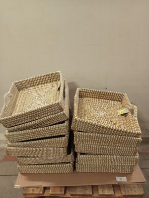 a stack of baskets on a pallet in a warehouse