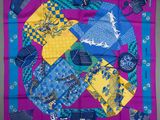 blue, yellow, and purple silk scarf with blue and yellow patterns