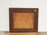 an image of a picture of a wooden frame on a shelf