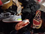 many pairs of shoes that are sitting in a bag
