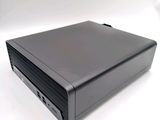 an image of a black computer sitting on top of a white surface