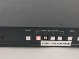 a close up of a black electronic device on a white surface