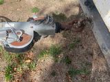 a small machine that is on the ground next to a wall