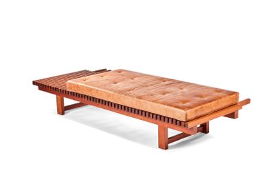 a wooden bench with a bench cushion on it