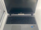 an open laptop computer sitting on top of a white table