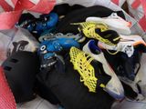 many pairs of shoes and skates in a bag