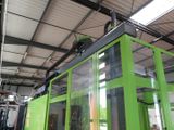 a large green machine that is sitting in a building