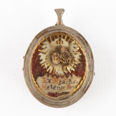 an image of a gold locke with a picture of a sunflower on it