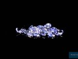 a close up of a bunch of blue sapphires on a black surface