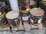 many buckets of paint sitting on a pallet