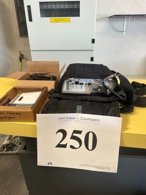 a bag of electronics on a table with a price tag