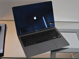 a laptop computer sitting on top of a glass table