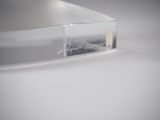 a clear plastic box with a logo on it