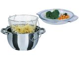 a silver pot with a strainer and a plate with broccoli and carrots