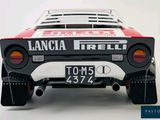 a close up of a toy car on a white surface