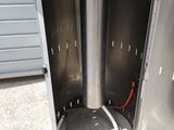a metal box that has a water heater inside of it