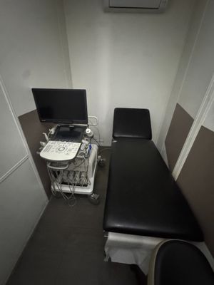 a black table with a computer on it in a room