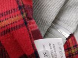 a close up of a red and blue plaid shirt