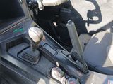 a close up of a car dashboard with a steering control