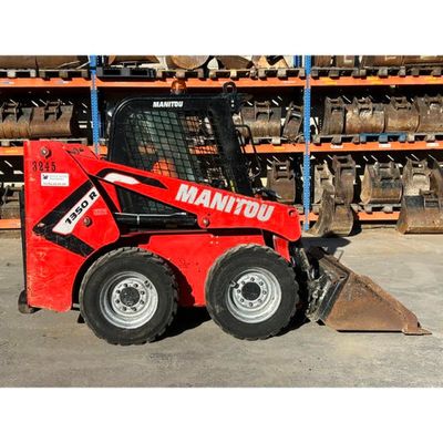 a picture of a red ski - door parked in a warehouse