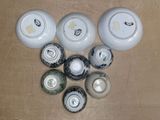 many different types of vases sitting on a table