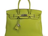 a lime green leather handbag with a lock on the handle