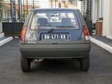 a small car that is parked on the side of the street