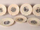 six plates with black and white images of people on them
