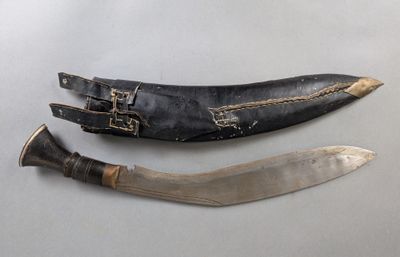 two knives are sitting next to each other on a table