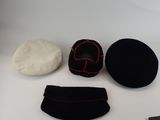 three hats and a pair of shoes on a table