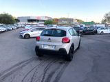 many cars parked in a parking lot in a parking lot