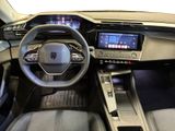 a picture of the interior of a car with a steering wheel and dashboard