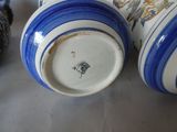 three blue and white vases sitting next to each other on a table
