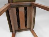 a green chair with a wooden arm rest and a green chair with a wooden arm rest and a green chair with a wooden arm rest and a green chair
