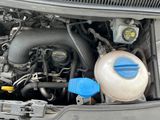 a picture of a car engine with its hood open