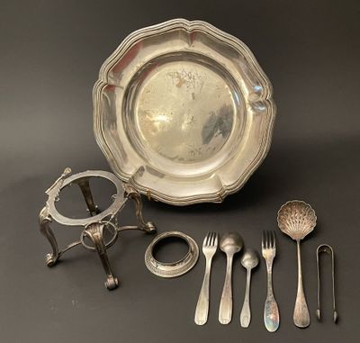 a lot of silverware on a table with spoons and forks